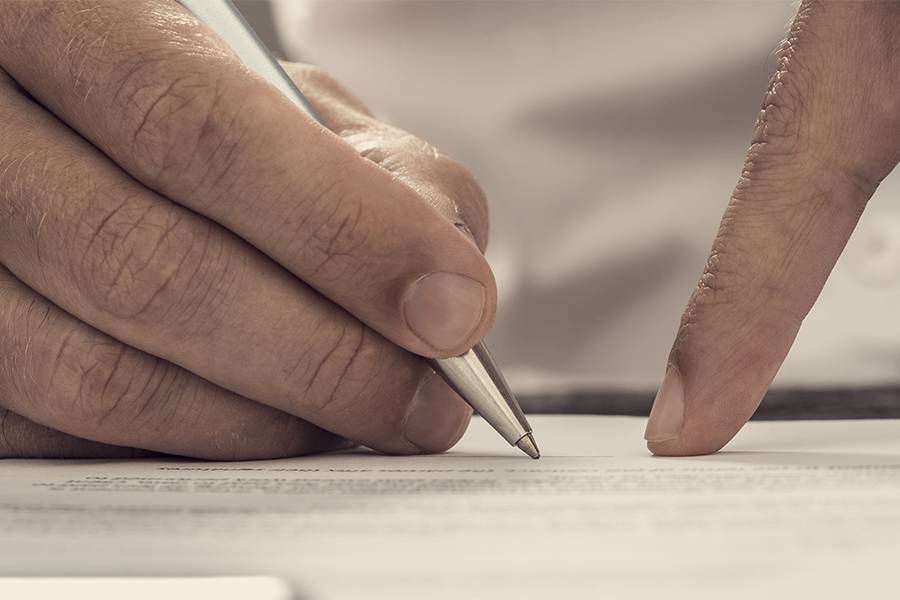 close up of a hand writing