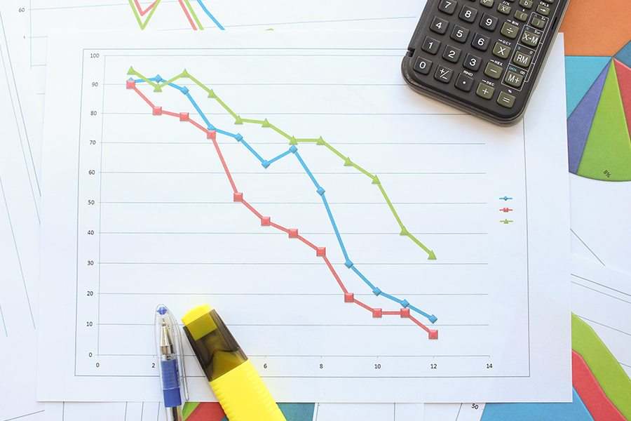 Graph showing a down arrow. Depreciation concept.