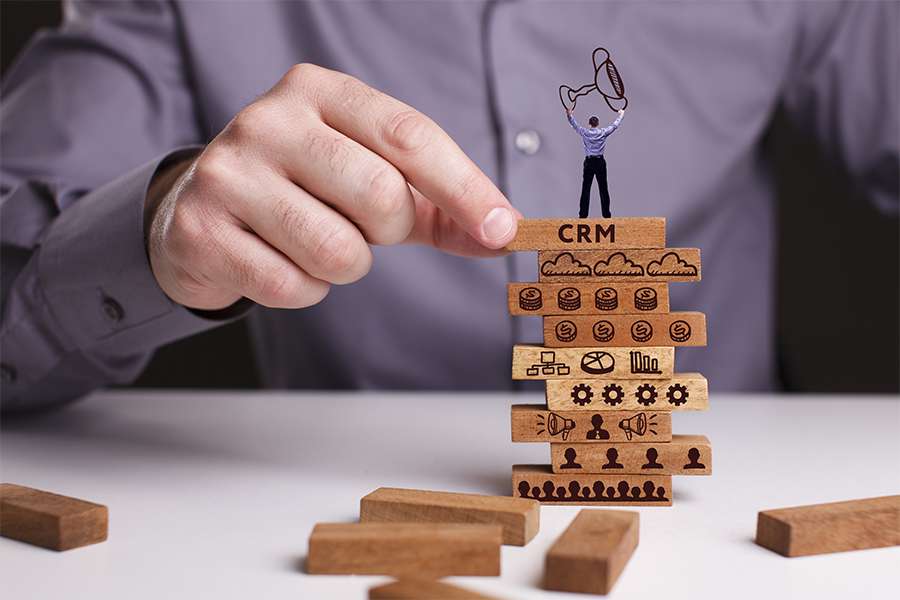 man on top of CRM blocks