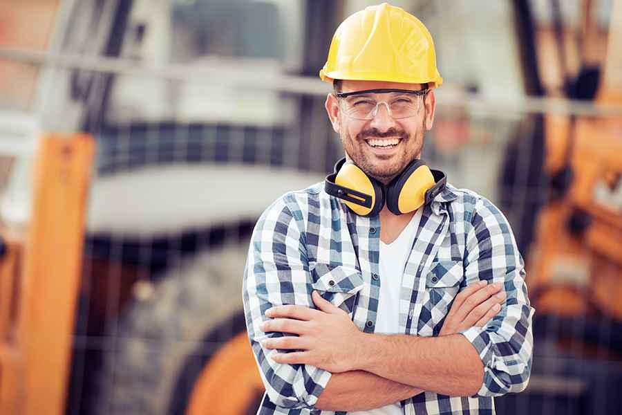 Construction worker taking a photo.