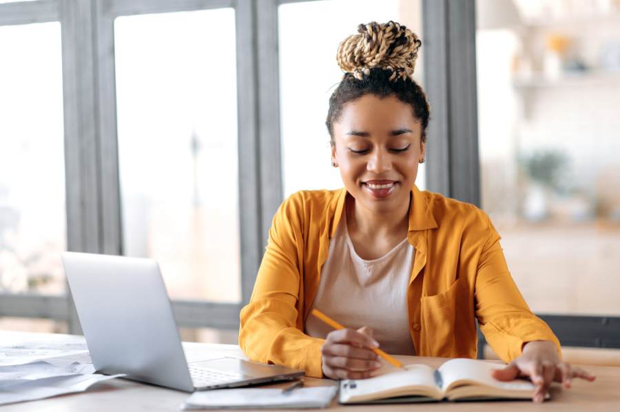 woman happily studying