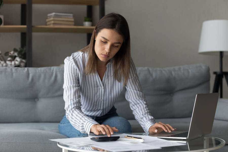 Woman calculating bills of the month.