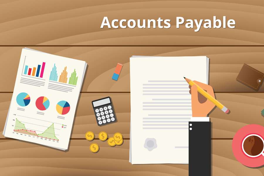 Accounts Payable Concept, various graphs, calculator, coins and a hand writing in a piece of paper.