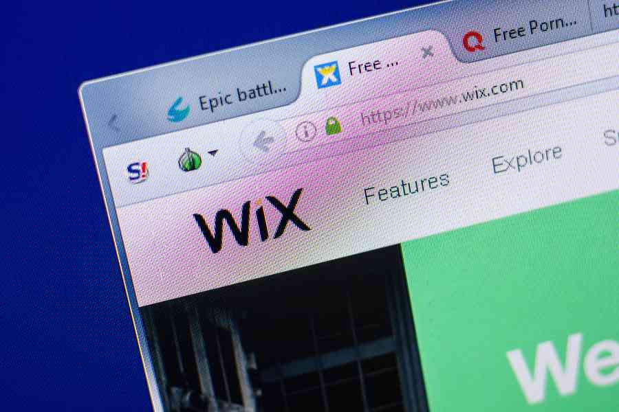WIX主页带有徽标和URL，在浏览器选项卡上。