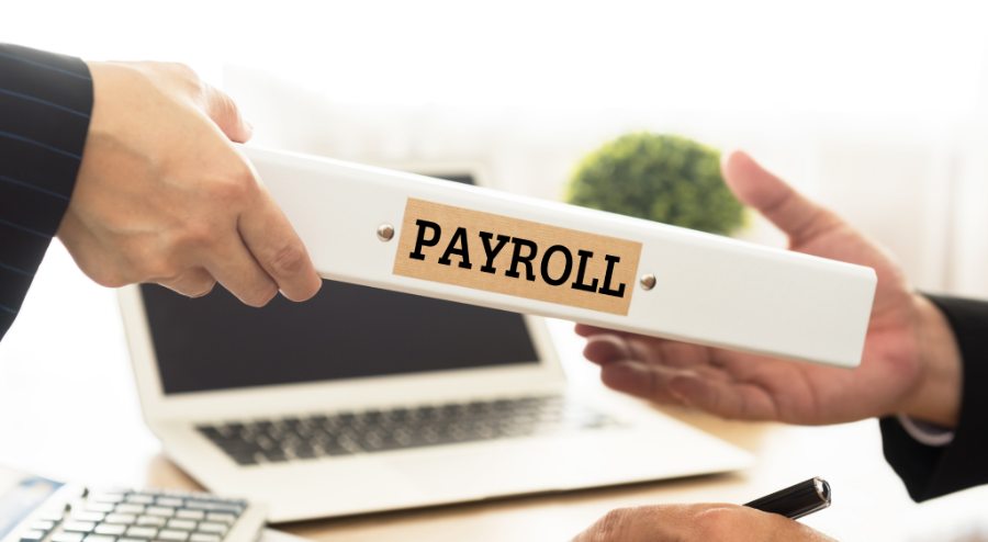 Showing an employer passing a payroll data to the an employee.