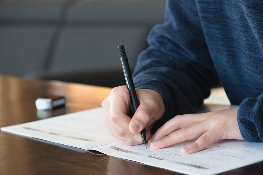 A student taking the real estate broker exam.