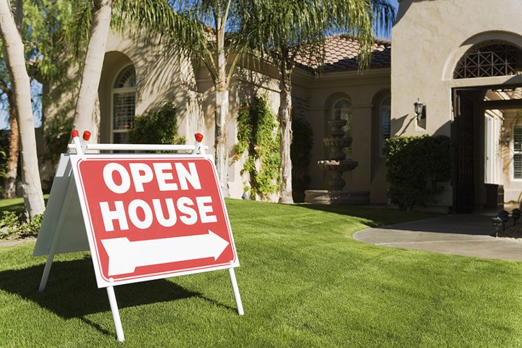 Open house sign in yard.