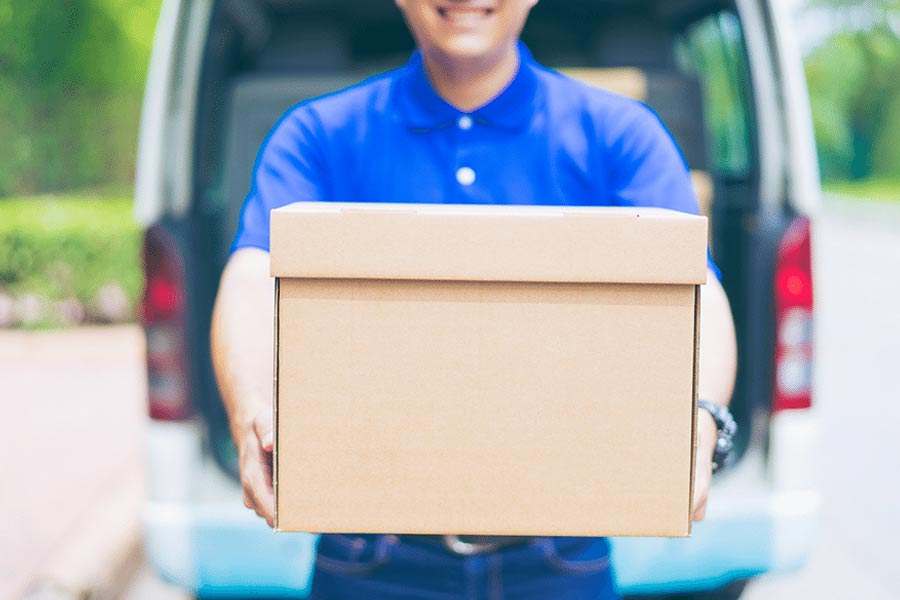 Man Carrying a Box.