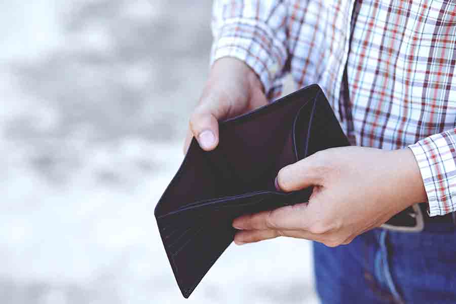 A man holding an empty wallet.