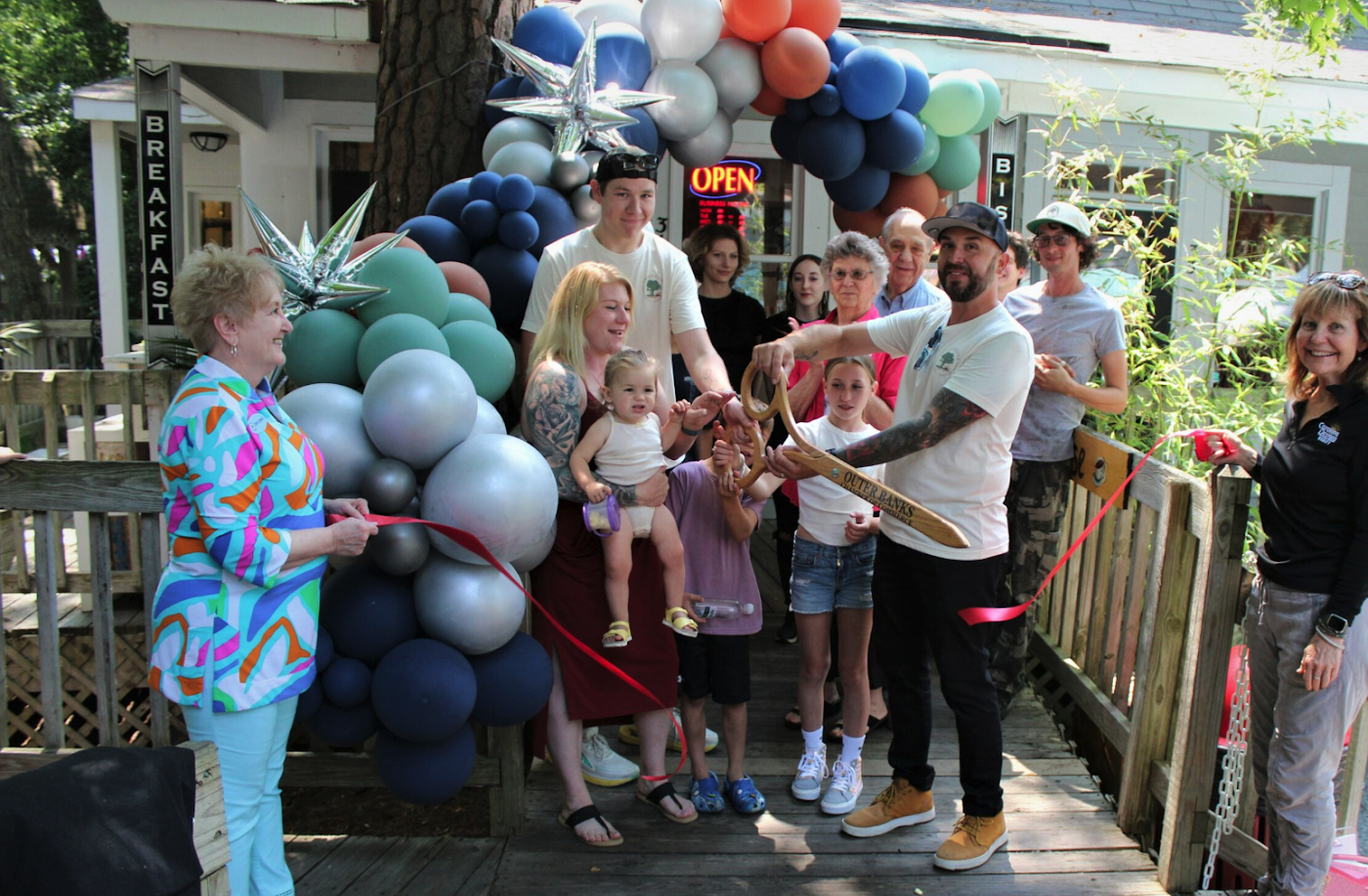 Photo of a grand opening of a coffee shop.