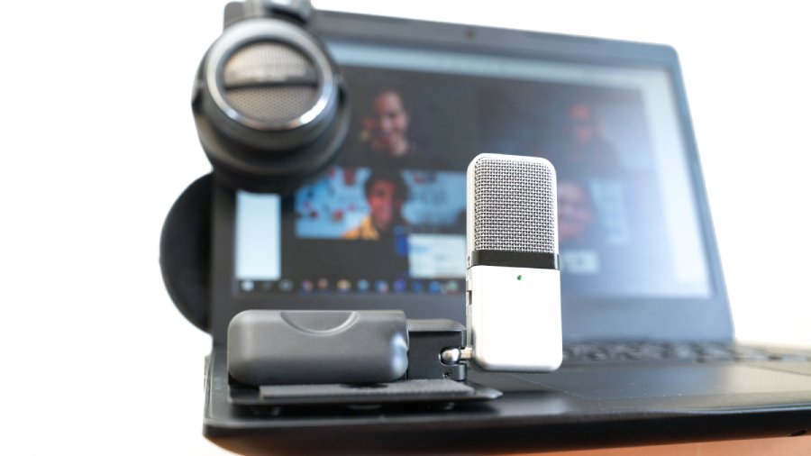 Using microphone and headphones equipments in an online video conference.