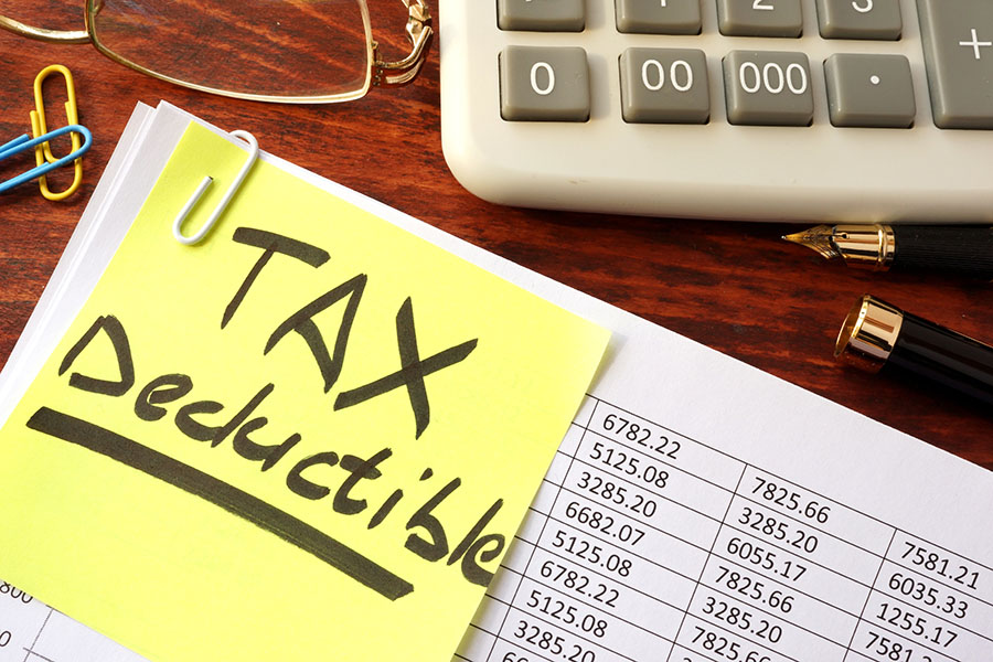 Sticker with title tax deductible and financial documents.