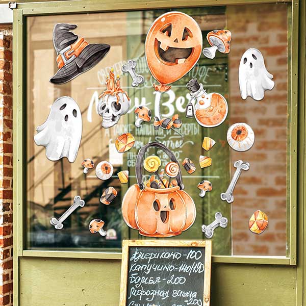 Halloween decals displayed on a store window.