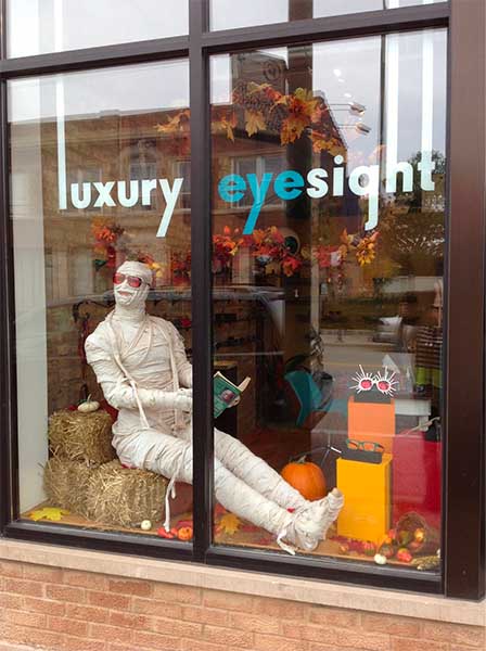 Mannequin dressed up as a mummy for an eyewear store window display.